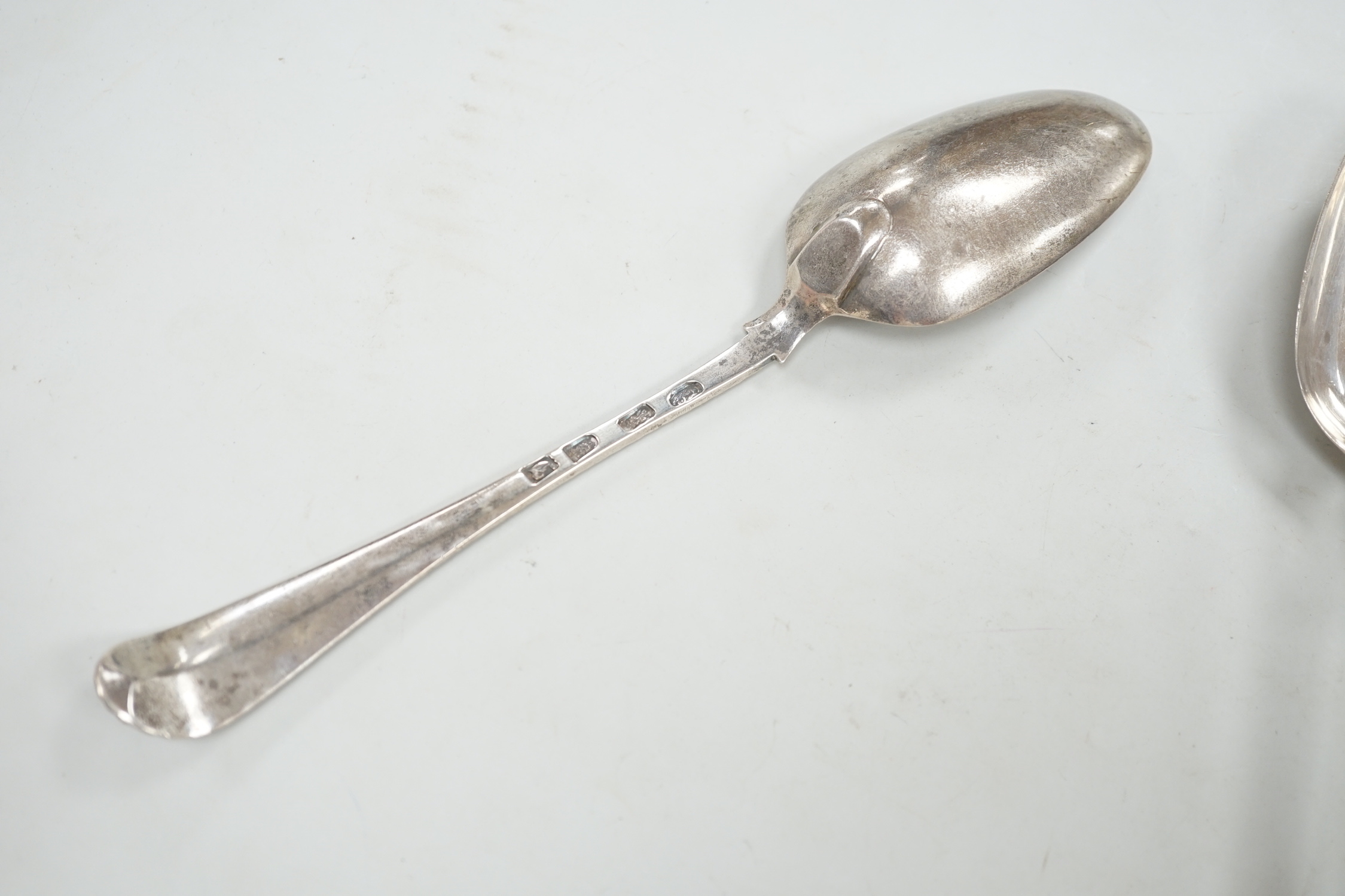 A set of six early George III silver Old English feather edge table spoons, Thompson Davis, London, 1764, 21.3cm, 12.6oz.